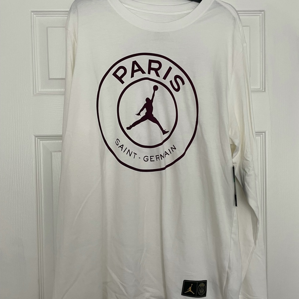 White Jordan shirt.